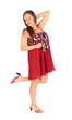 Beautiful dreaming woman dressed in red pareo poses in studio