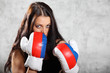 Photo: Sexy brunette girl stand in boxing rack, half body Sexy brunette girl stand in boxing rack, half body