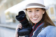 Photo: Beautiful woman photographer holding photo camera Beautiful woman photographer holding photo camera