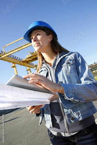 Photo: Woman engineer on building site using tablet Woman engineer on building site using tablet