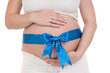 Pregnant belly with blue ribbon