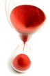 Photo: Hourglass with red sand and top view Hourglass with red sand and top view