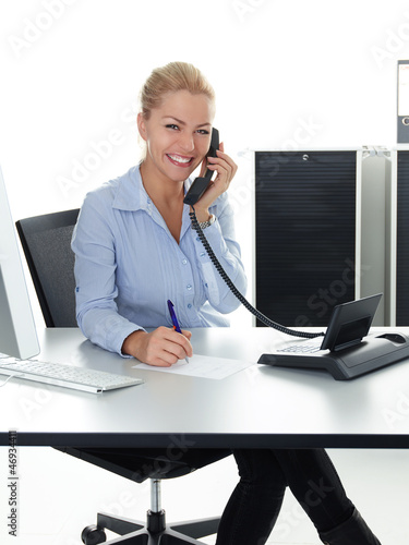 Photo: Young woman is having a good call in business Young woman is having a good call in business