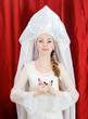Russian girl in traditional costume and kokoshnik