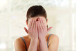 Teen woman covering her eyes