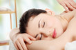 Photo: Preaty young woman beeing massaged in spa Preaty young woman beeing massaged in spa