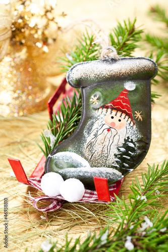 Photo: Stocking Santa Claus on Christmas sleigh. Christmas decoration. Stocking Santa Claus on Christmas sleigh. Christmas decoration.