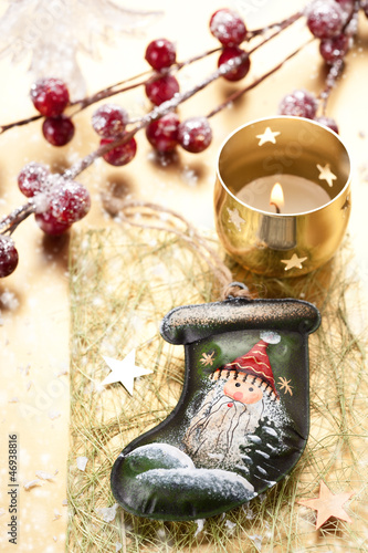 Photo: Christmas Stocking Santa Claus and burning candle Christmas Stocking Santa Claus and burning candle