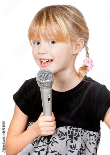 Photo: Child with microphone singing Child with microphone singing