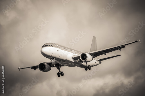 Photo: sepia toned aircraft landing in turbulence sepia toned aircraft landing in turbulence
