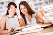 Women at the library with a e-book reader