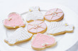 Foto: many pink cookies on a white plate many pink cookies on a white plate
