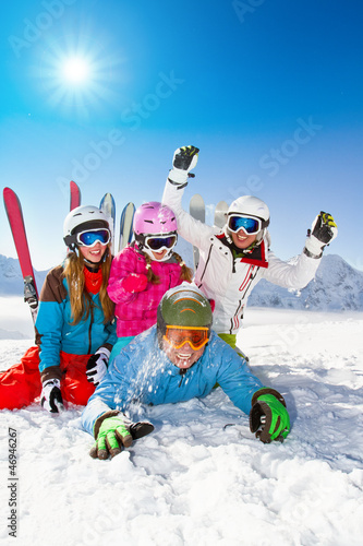 Photo: Ski, snow, sun and winter fun - happy family ski team Ski, snow, sun and winter fun - happy family ski team