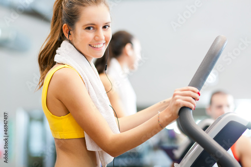 Photo: Running on treadmill and listening to music Running on treadmill and listening to music
