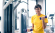 Photo: Young girl exercising with dumbbells in the gym. Young girl exercising with dumbbells in the gym.