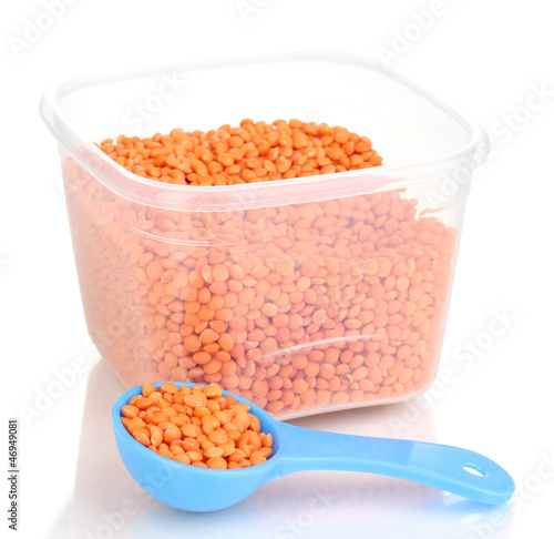Photo: Measuring spoons and plastic containers with grain isolated Measuring spoons and plastic containers with grain isolated