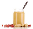 Delicious peanut butter in jar isolated on white