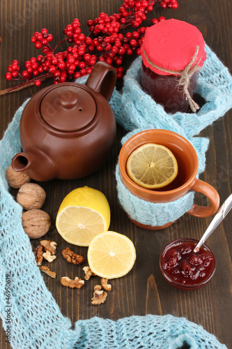 Photo: Helpful tea with jam for immunity on wooden table close-up Helpful tea with jam for immunity on wooden table close-up