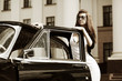 Photo: Young woman with retro car Young woman with retro car