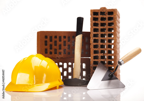 Photo: Brick, yellow hard hat, tools Brick, yellow hard hat, tools