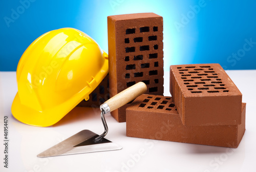 Photo: Brick, yellow hard hat, tools Brick, yellow hard hat, tools