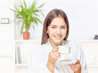 Woman in bathrobe relaxing at home