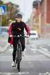 Photo: Female Cyclist With Courier Delivery Bag Female Cyclist With Courier Delivery Bag