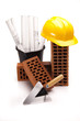 Brick, yellow hard hat, tools