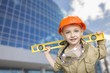Child Boy Dressed Up as Handyman in Front of Building