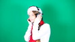 Little girl Santa listening to music