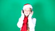 Little girl Santa listening to music