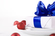Photo: White present with blue ribbons White present with blue ribbons