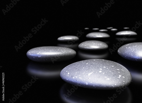 Illustration: many pebbles in a row over black background many pebbles in a row over black background