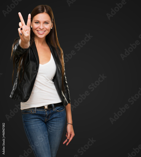 Photo: Beautiful Woman Giving Victory Sign Beautiful Woman Giving Victory Sign