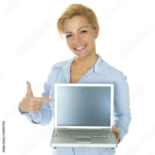 Photo: Business woman pointing at her laptop with copyspace Business woman pointing at her laptop with copyspace