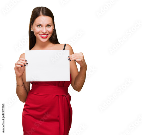 Photo: Beautiful woman holding a blank placard Beautiful woman holding a blank placard