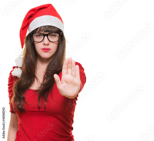 Photo: christmas woman doing a stop gesture christmas woman doing a stop gesture