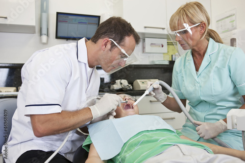 Photo: A young boy patient having dental treatment A young boy patient having dental treatment