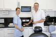 A dentist and dental nurse in a dental surgery