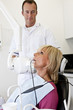 A female patient having an x-ray at the dentist