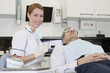 A female dentist with a male patient