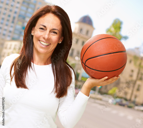 Photo: Women with globe on head Women with globe on head