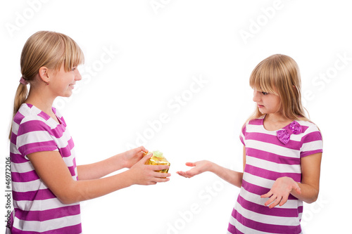 Photo: Girl rejecting a gift because it's too small Girl rejecting a gift because it's too small