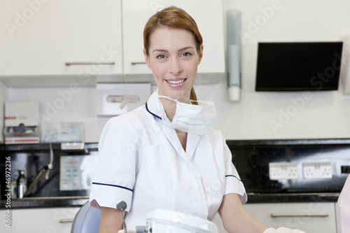 Photo: A female dentist in a dental surgery A female dentist in a dental surgery