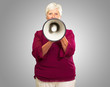 Photo: Portrait Of A Senior Woman With Megaphone Portrait Of A Senior Woman With Megaphone