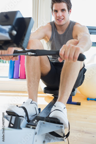Photo: Man working out on row machine Man working out on row machine