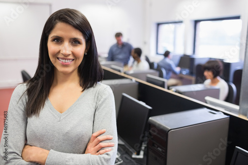 Photo: Woman smiling and standing in the front Woman smiling and standing in the front