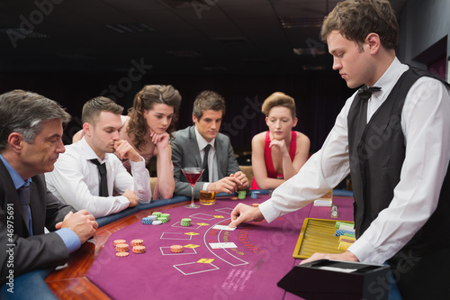 Photo: People playing poker People playing poker