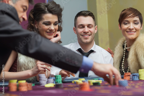 Photo: Amused group in a casino Amused group in a casino