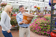 Couple deciding on flower pot